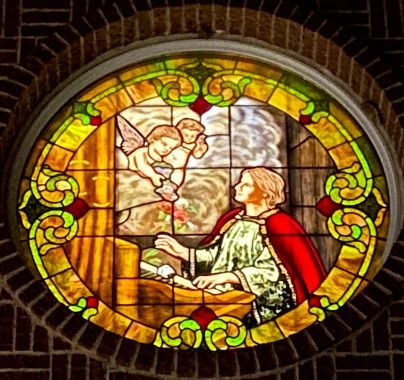 St. Cecilia window in the tower facade of a Nebraska church.